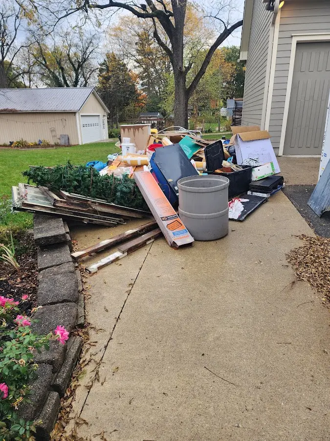 Dumpster being loaded with debris for 3 Yard Dumpster Rental in Muskego